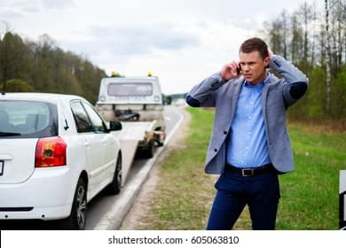 Alpha Tow driver responding to a stranded motorist on a DFW roadside